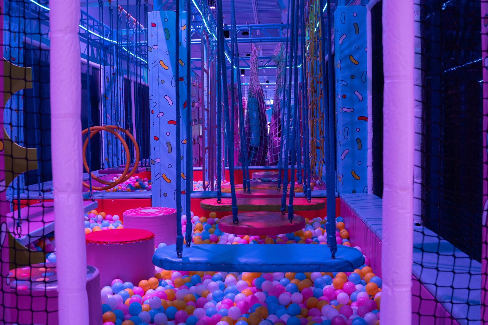 Kids climbing and swinging on the Ninja Course at Candeeland McAllen