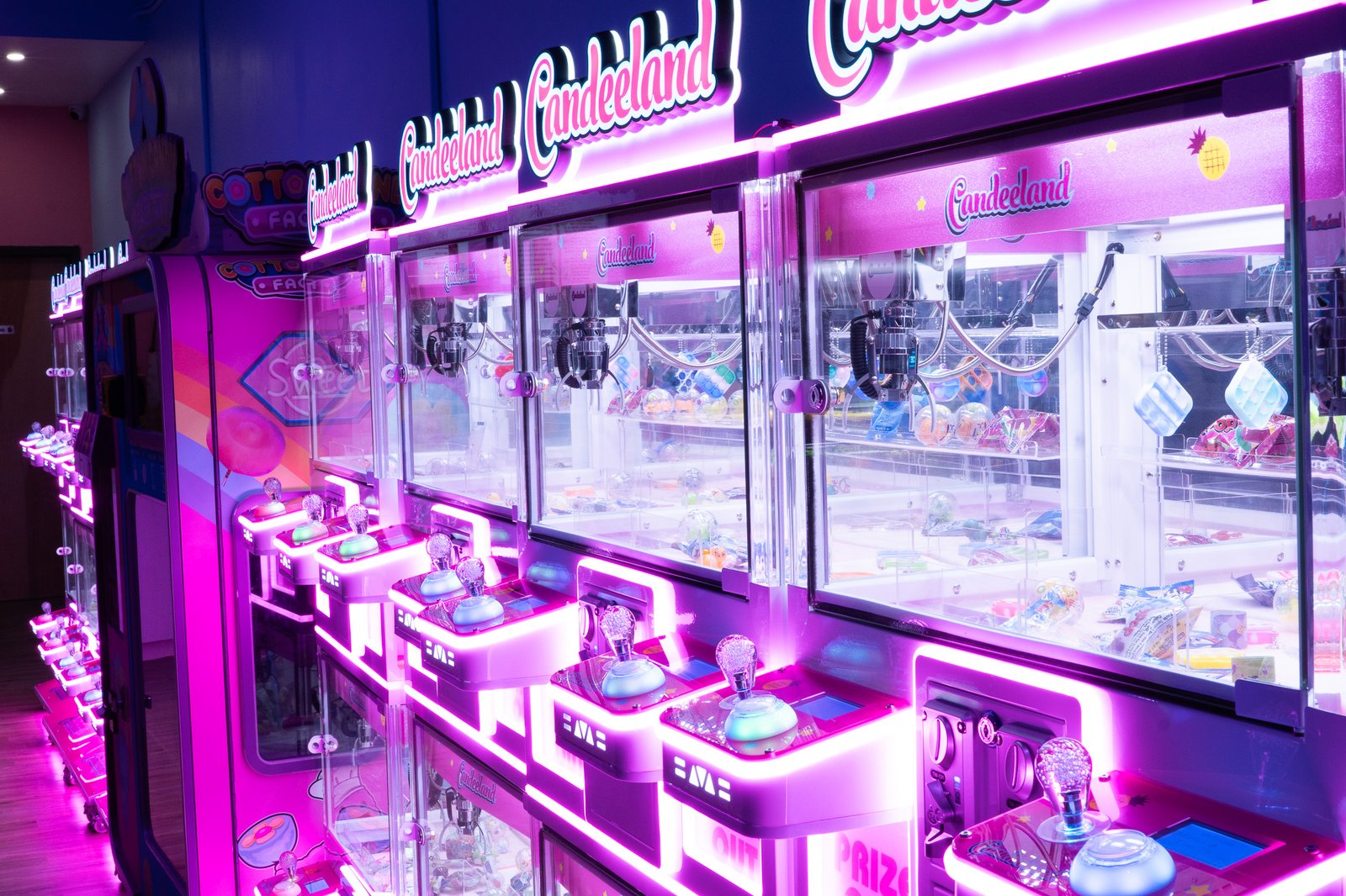 Claw machine prize wall at Candeeland McAllen